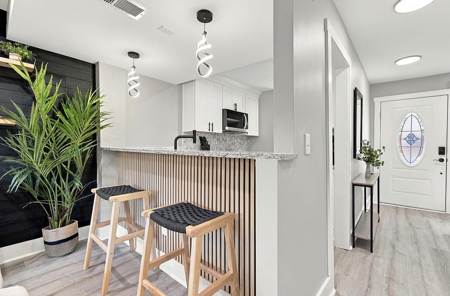 Kitchen breakfast bar with stools and pendant lights