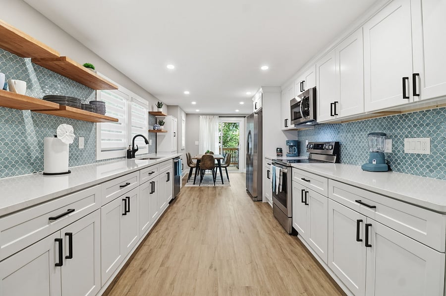 Kitchen with open shelving and view to dining