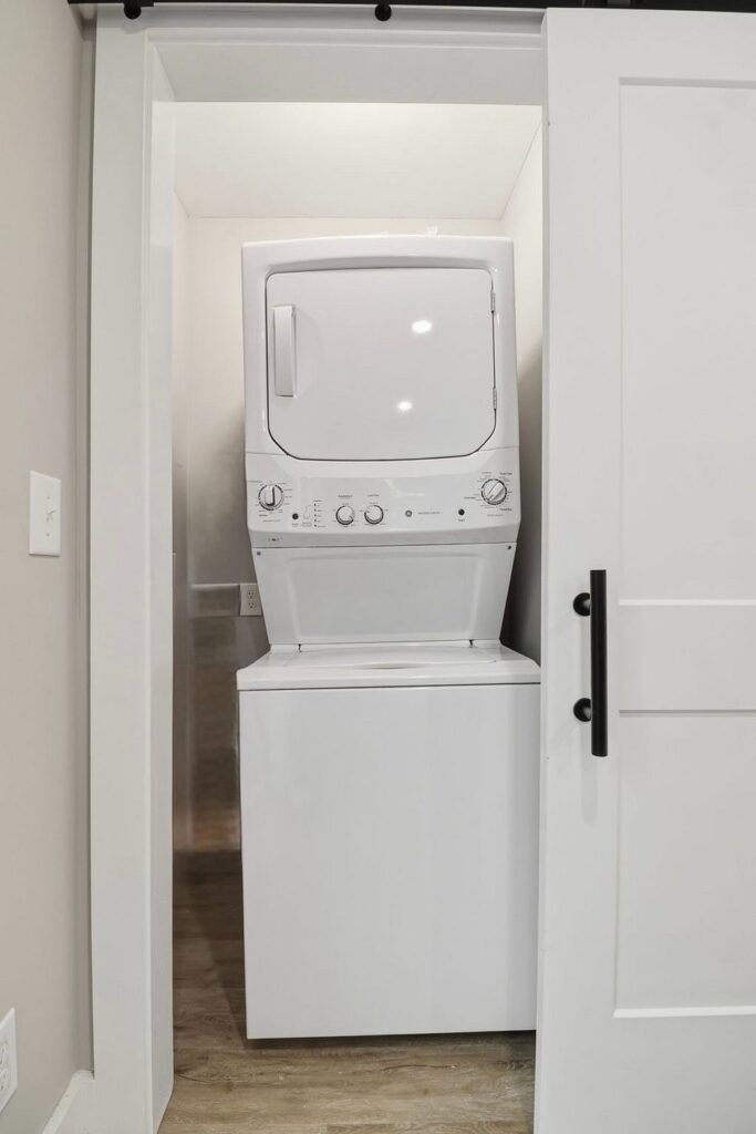 In-unit stacked washer and dryer